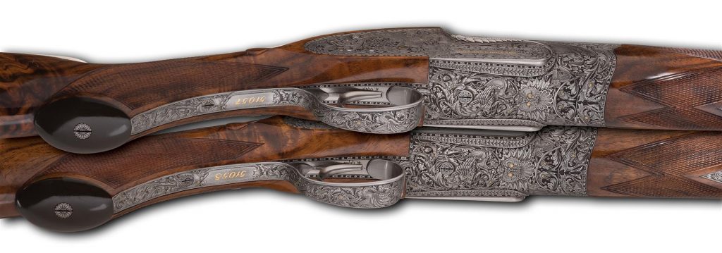 Pair of engraved Holland and Holland sporting arms