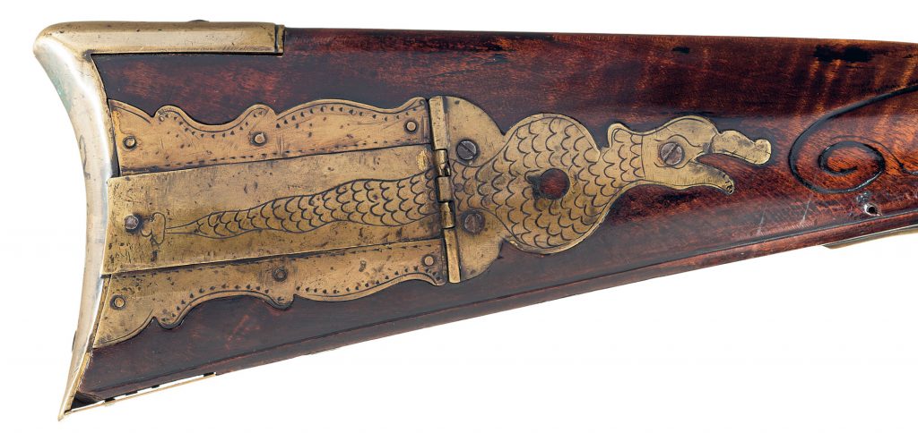 Rattlesnake engraving appearing on the patchbox of a scarce Jacob Dickert Lancaster flintlock long rifle